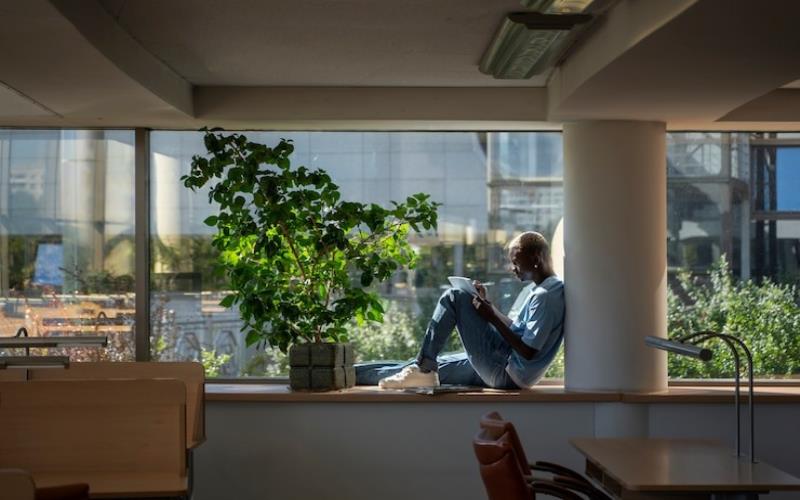 How Commercial Real Estate is Pioneering Eco-Innovation full shot of an employee on a break in an eco-friendly office